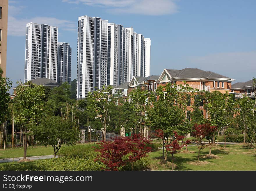 Blue sky and sun, the summer high-rise buildings, residential villas, green garden, a beautiful living environment. Blue sky and sun, the summer high-rise buildings, residential villas, green garden, a beautiful living environment.