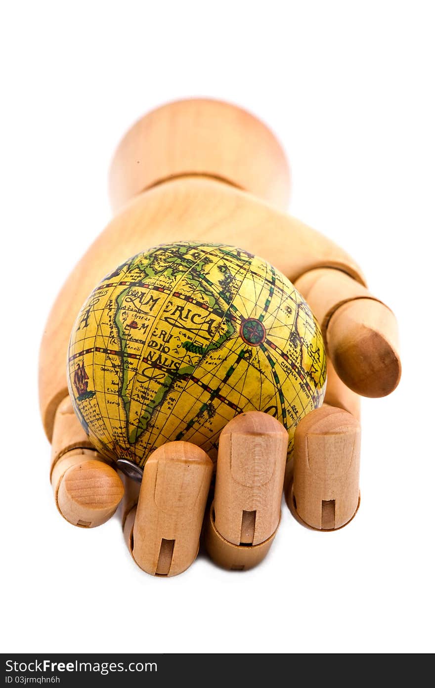 Global in wooden hand, on white isolated background