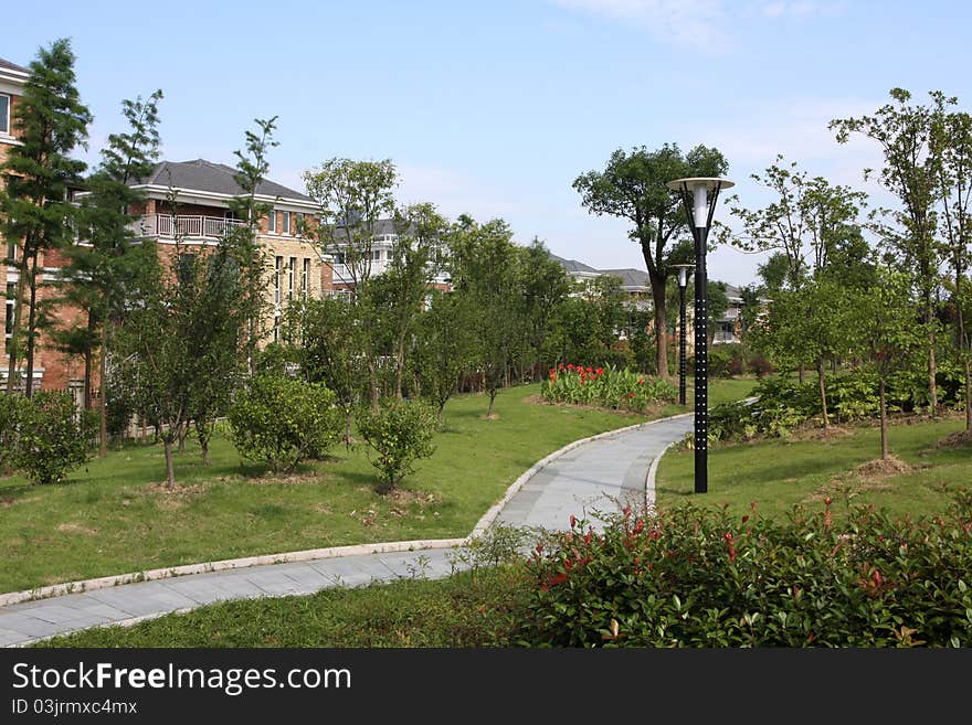 Park views, a footpath, a landscape, sunny, and beautiful buildings.