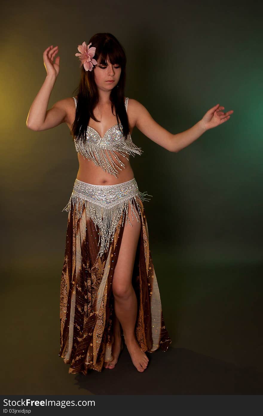 Belly dancer in action, performing on music