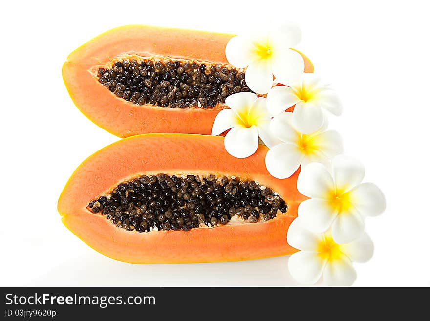 Freshly sliced Papaya with white flowers isolated on white background. Freshly sliced Papaya with white flowers isolated on white background