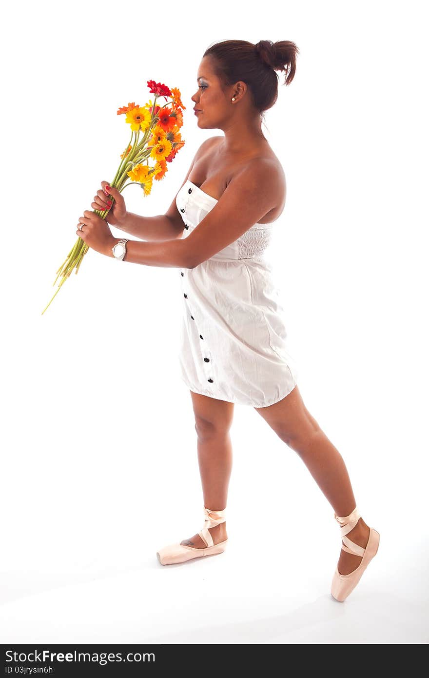 Ballet dancer preforming an act with the flowers