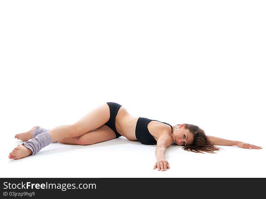 Beautiful woman lying on floor doing yoga pose