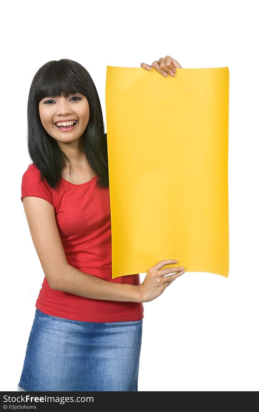 Asian woman in red shirt holding yellow sign/banner isolated over white background. Asian woman in red shirt holding yellow sign/banner isolated over white background