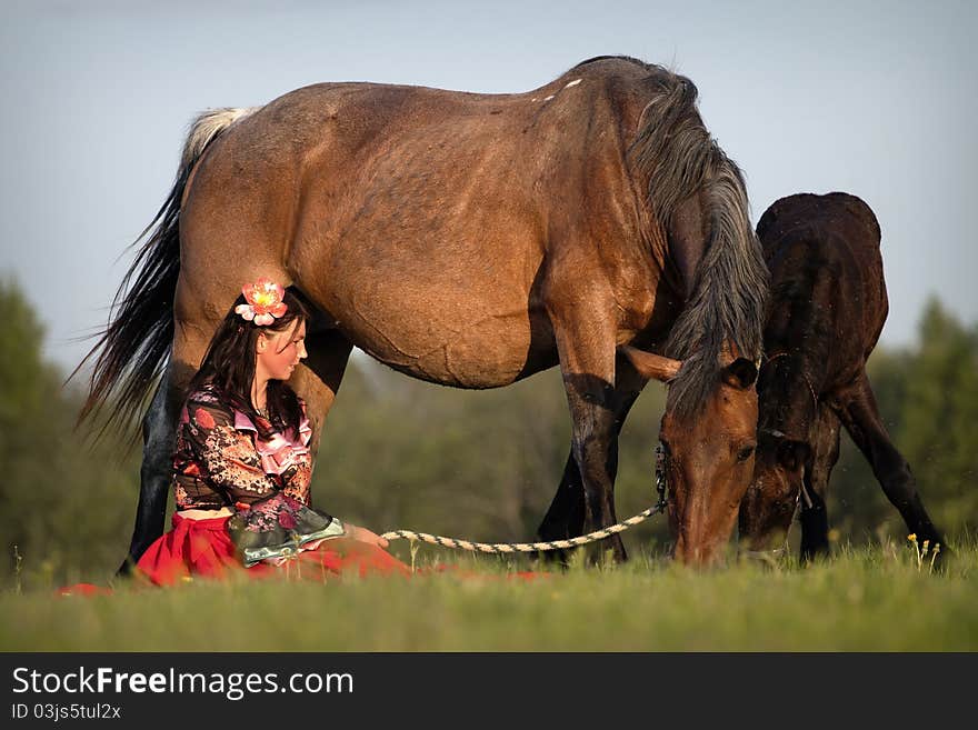 Beautiful Girl With Horses At Sunset