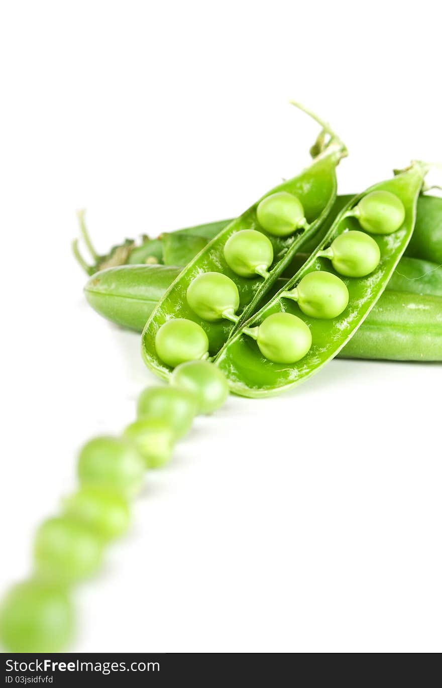 Fresh green peas isolated on a white background