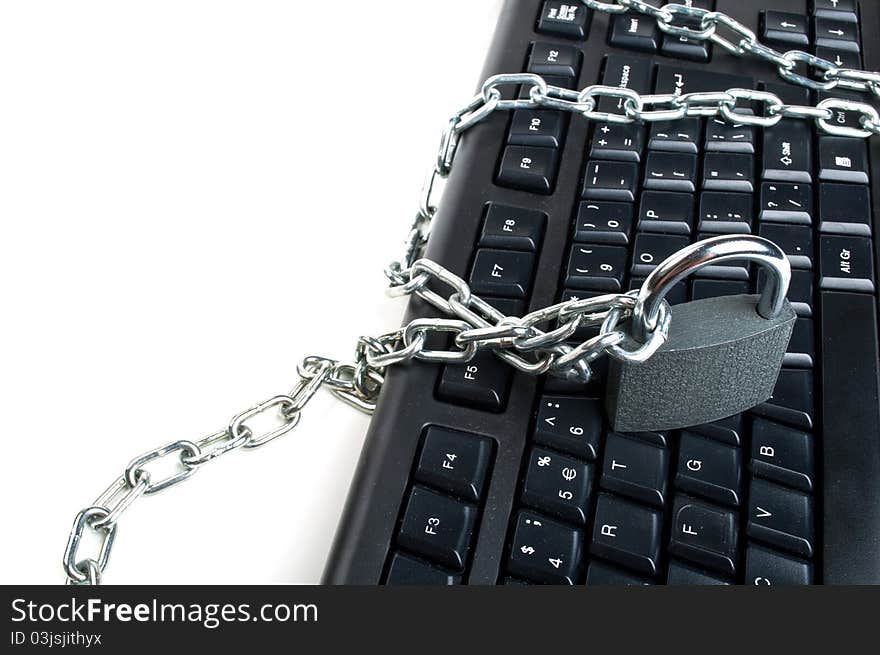 Computer keyboard and lock isolated on a white background