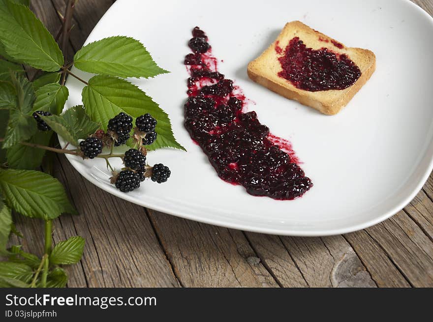 Blackberry  Jam On A White Dish