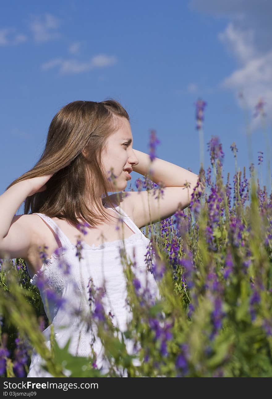 Girl walking in a meadow