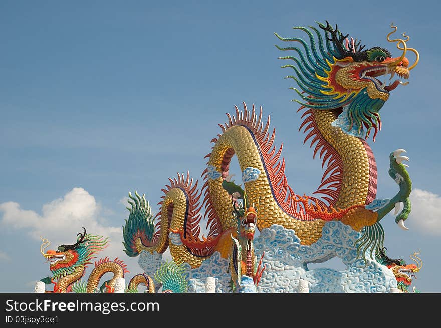 Chinese dragon statue with blue sky