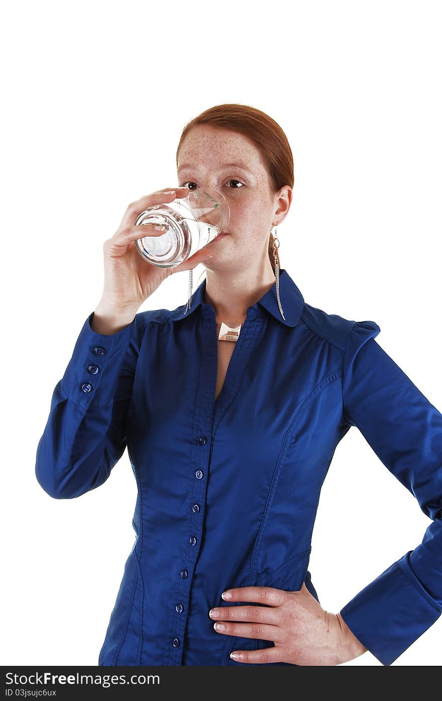 A young healthy woman standing in the studio and drinking a glass
of water, for white background. A young healthy woman standing in the studio and drinking a glass
of water, for white background.