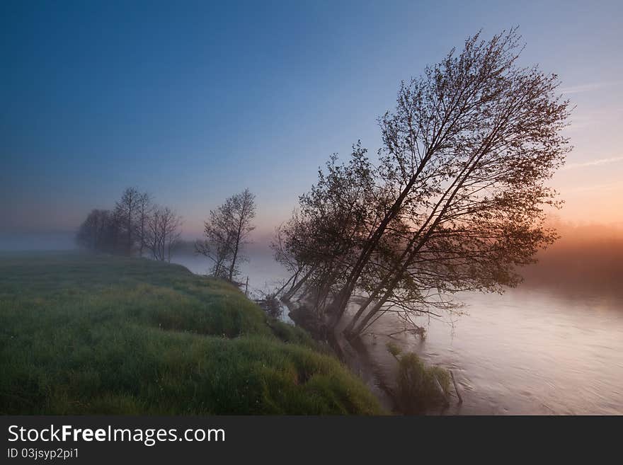 Colorful, misty sunrise on the river. Colorful, misty sunrise on the river.