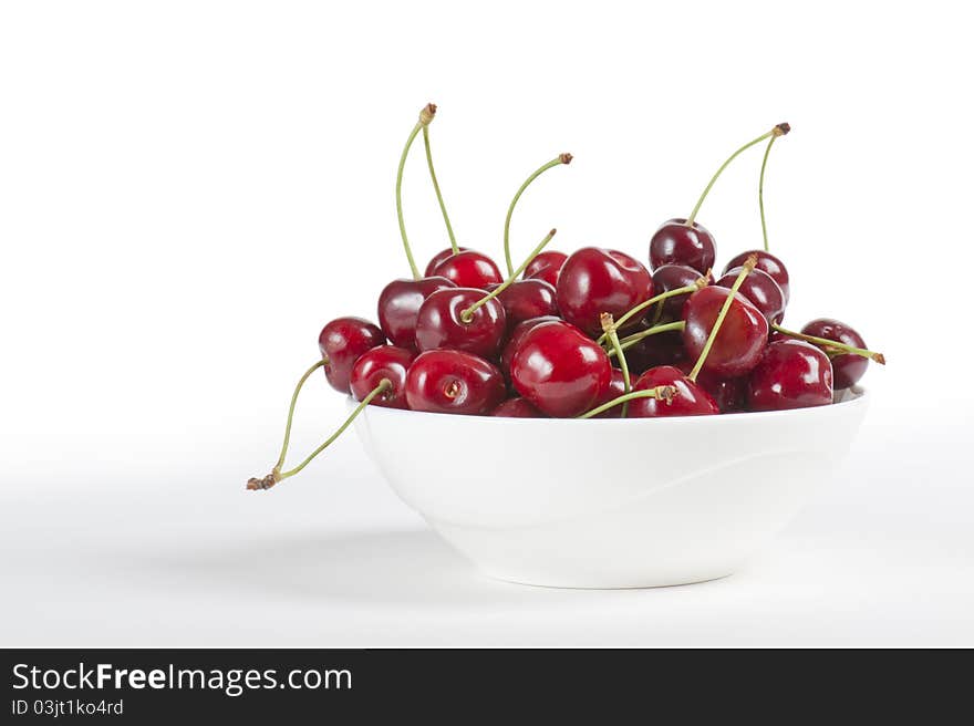 Cup with cherries, on white background. Cup with cherries, on white background