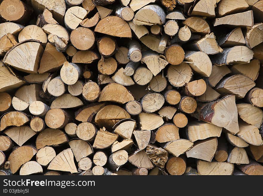 Stacked firewood of birch and pine