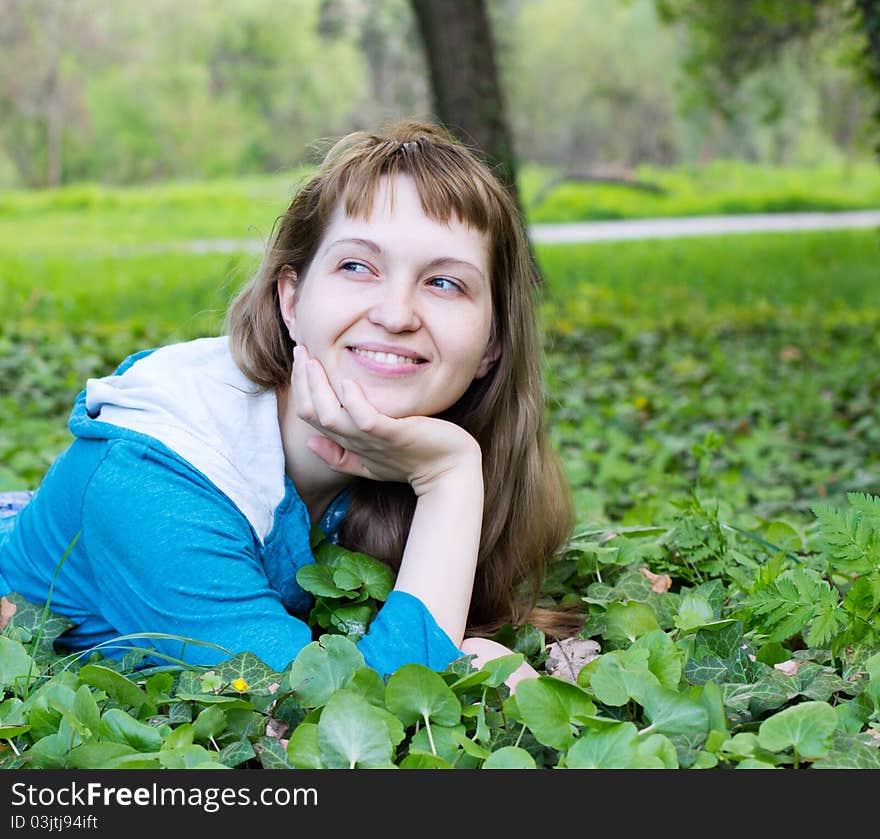 Single beautiful woman relaxing at the park. Single beautiful woman relaxing at the park