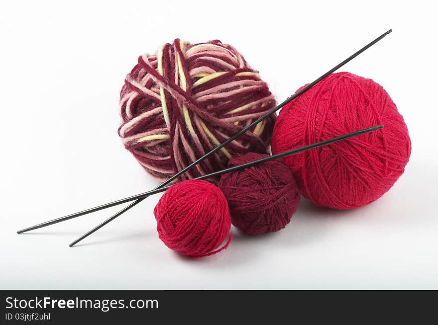 Four colored wool clews