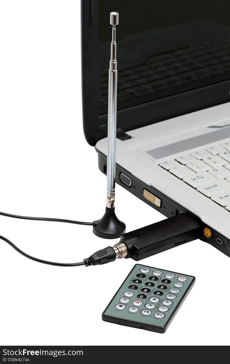 USB TV tuner for a laptop with a remote control and antenna. USB TV tuner for a laptop with a remote control and antenna