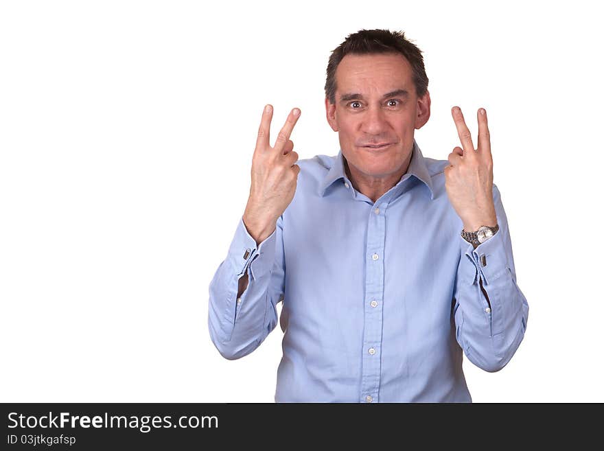 Attractive Frustrated Man in Blue Shirt Giving Two Fingers Sign. Attractive Frustrated Man in Blue Shirt Giving Two Fingers Sign