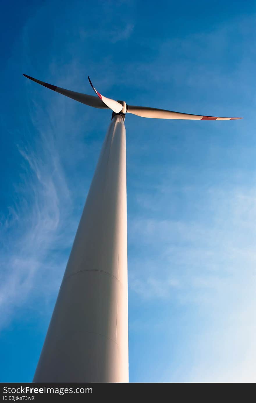 Wind turbine in front of blue sky