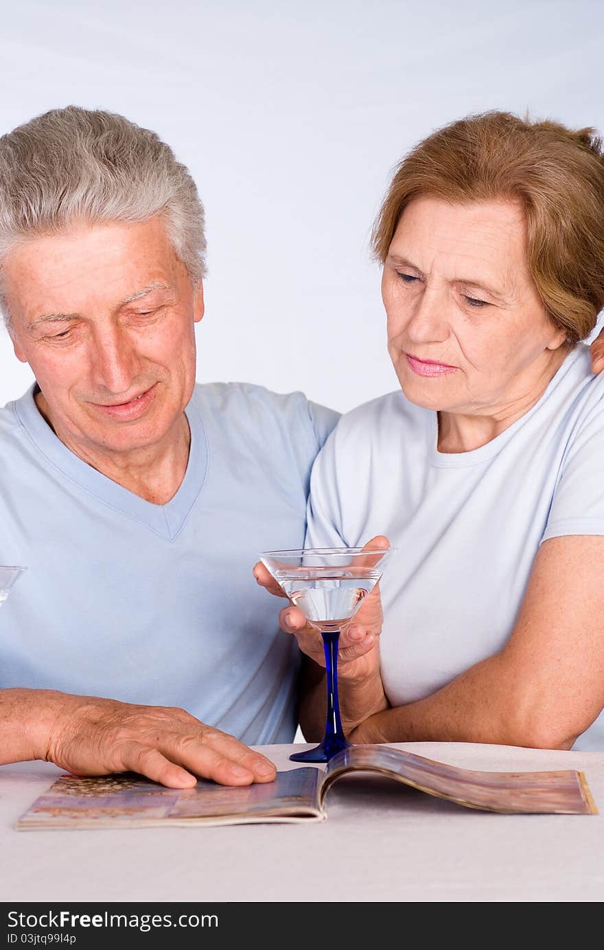 Happy elderly couple on a white background. Happy elderly couple on a white background