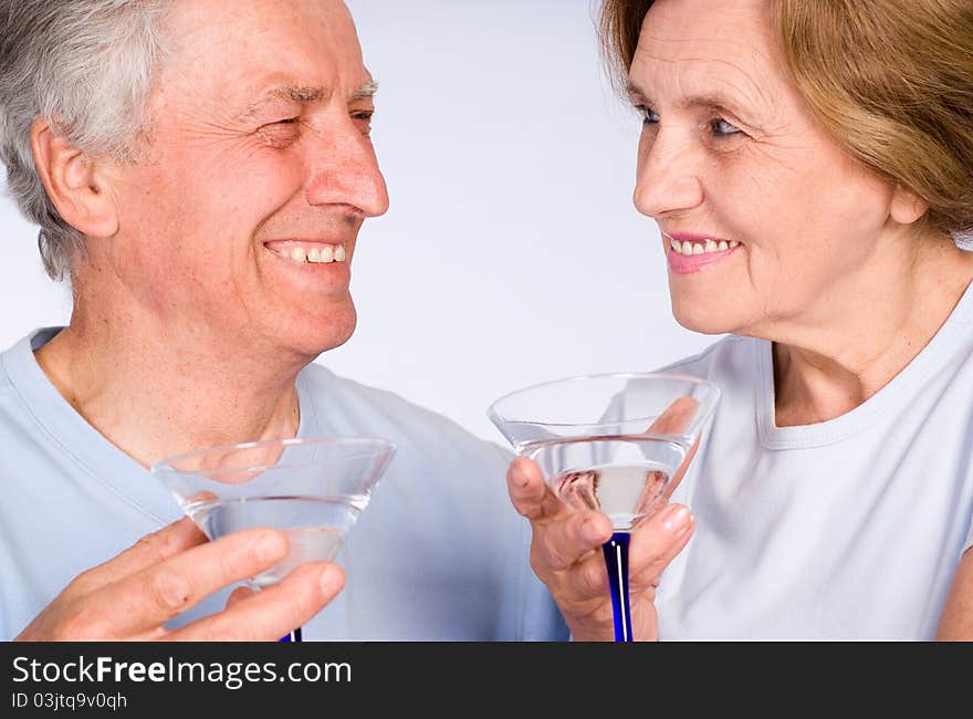 Happy elderly couple on a white background. Happy elderly couple on a white background