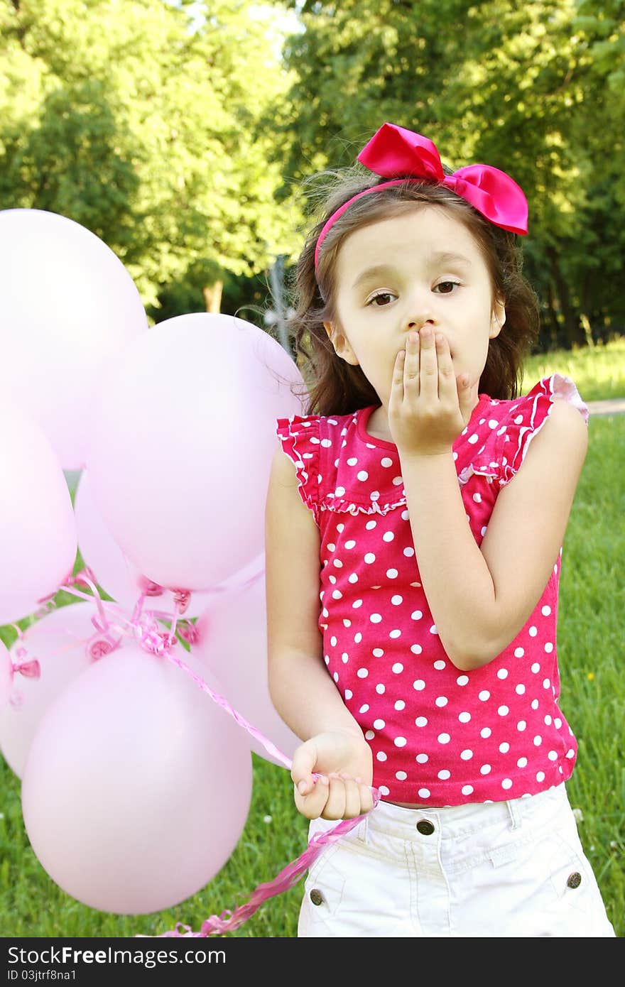 Little Girl In The Park With Pink Balloons