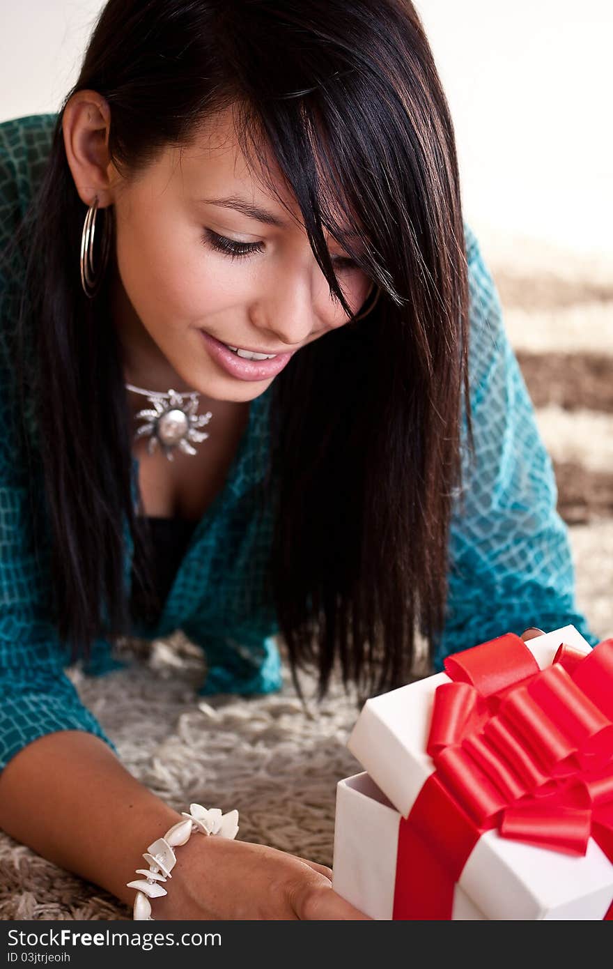 Woman On The Floor With Gift Box