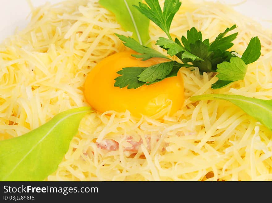 Macaroni baked with fish on a white plate