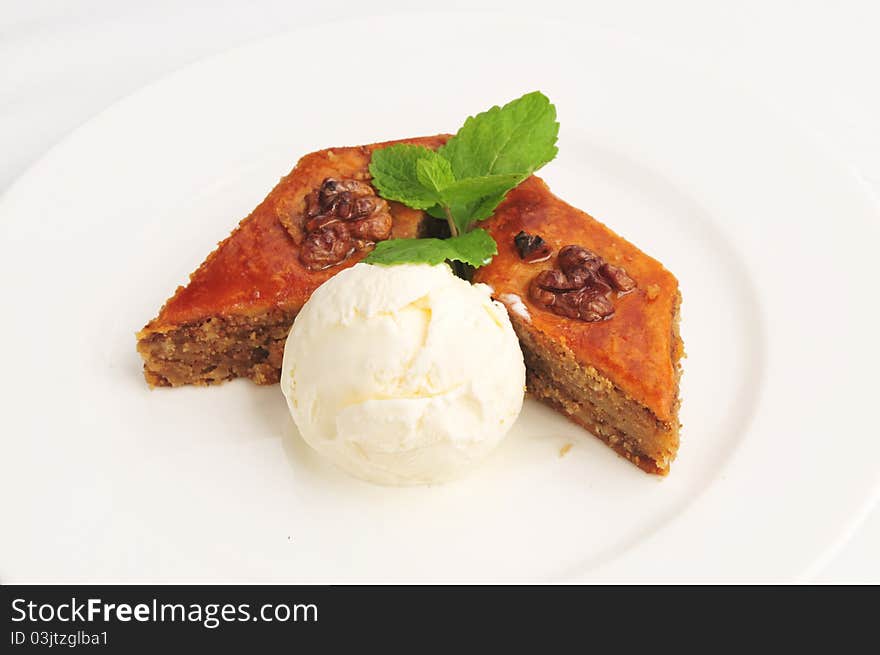 Ice-cream with a pie on a white plate