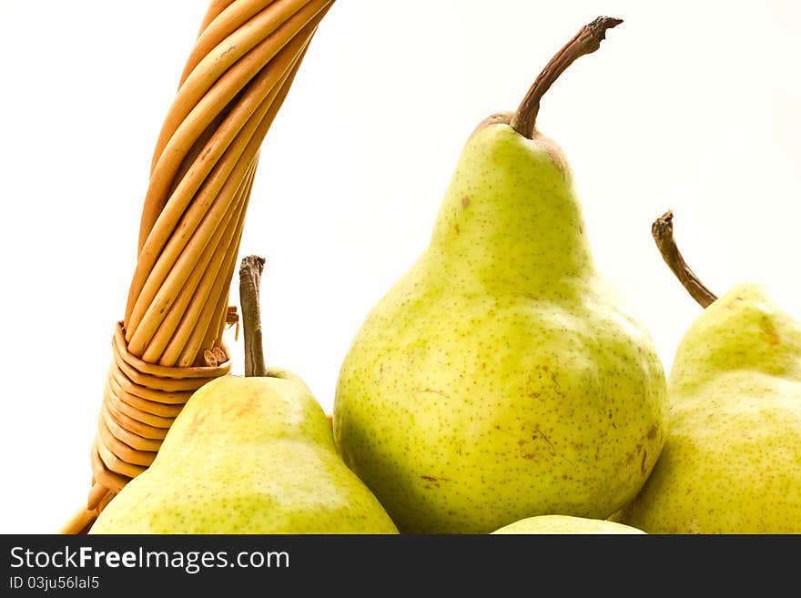 Delicious ripe pears in the basket