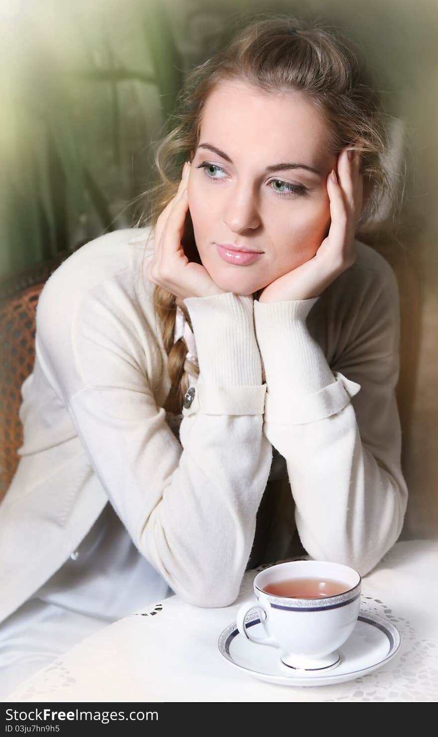 Young Blond Girl In Cafe