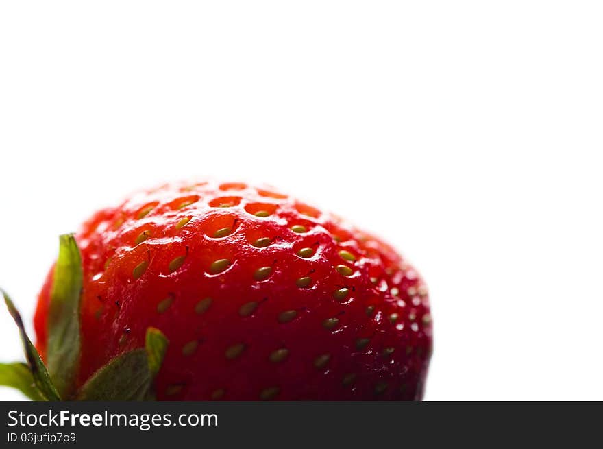 Natural ripe red strawberry over white