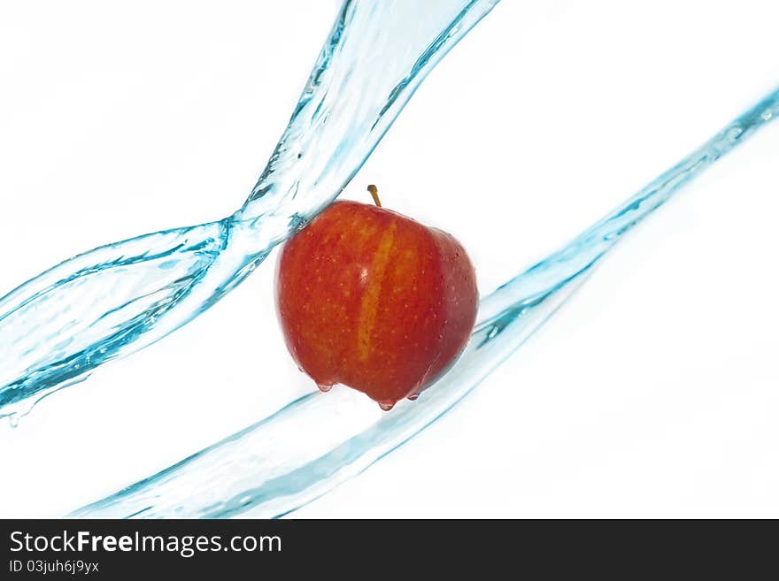 Apple and water splashes mid-air