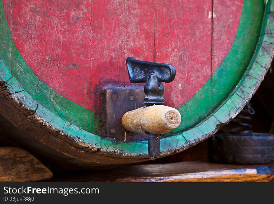 Italy - old tap on a barrel of Barbera wine, Piedmont region. Italy - old tap on a barrel of Barbera wine, Piedmont region