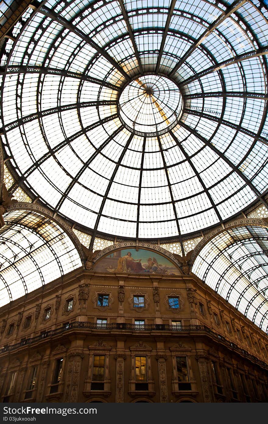 The Galleria Vittorio Emanuele II is a covered double arcade formed of two glass-vaulted arcades at right angles intersecting in an octagon, prominently sited on the northern side of the Piazza del Duomo in Milan. The Galleria Vittorio Emanuele II is a covered double arcade formed of two glass-vaulted arcades at right angles intersecting in an octagon, prominently sited on the northern side of the Piazza del Duomo in Milan.