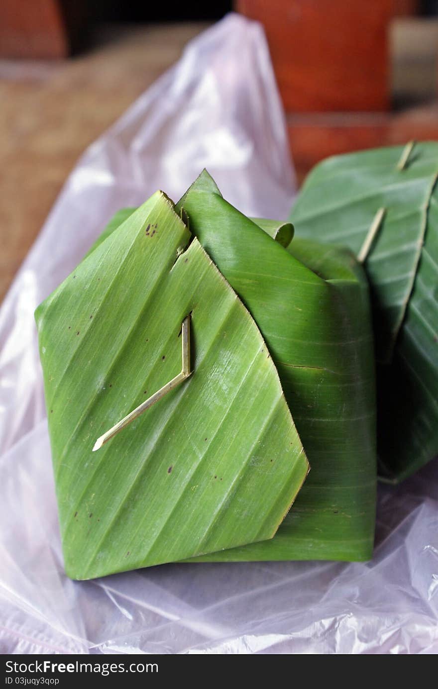 Rice cooked with coconut milk in banana leaf