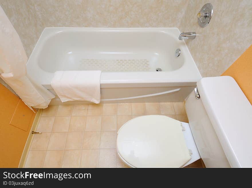 Top down view new and clean white toilet and tub. Top down view new and clean white toilet and tub.