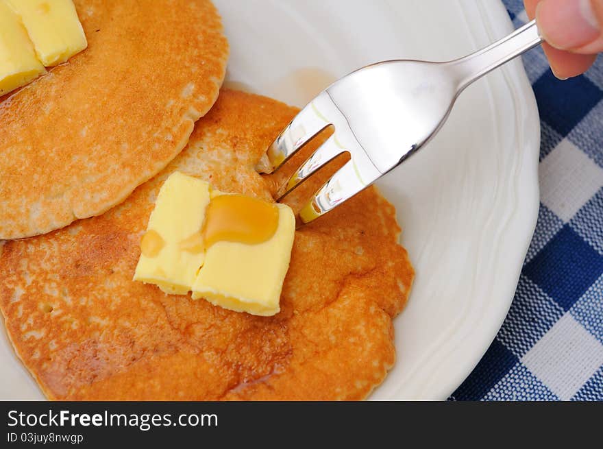 Eating pancake with fork