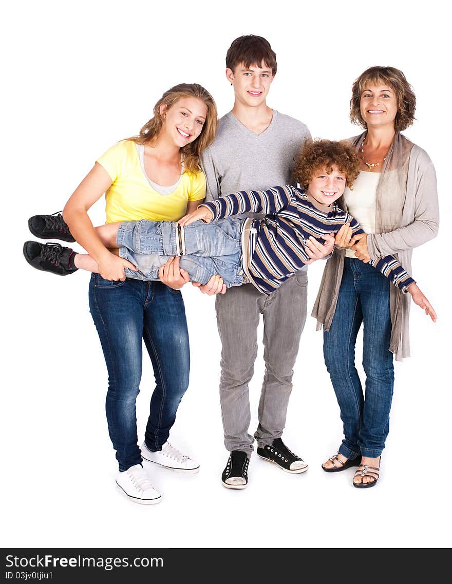 Happy family of four posing in style, indoors.