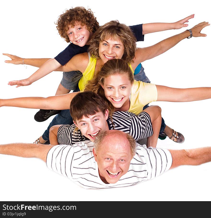 Cheerful family having fun in the studio isolated over the white background..