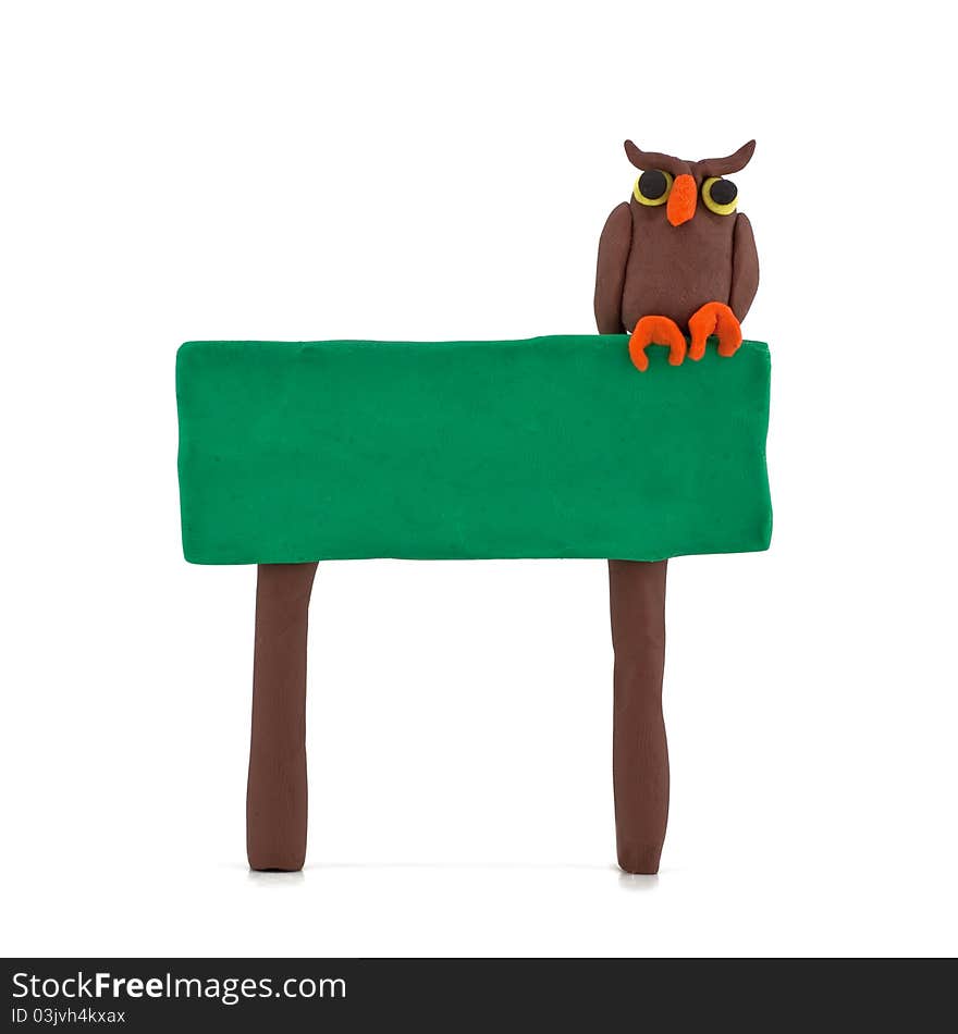 Owl sitting on a billboard isolated on white background