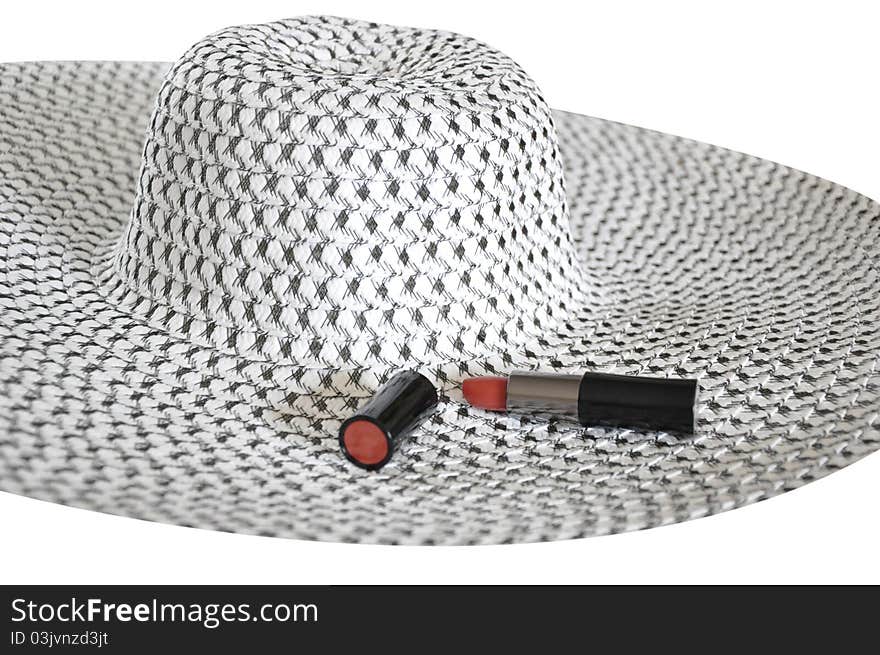 Female summer hat and red lipstick isolated on white. Female summer hat and red lipstick isolated on white