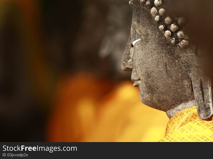 Close up of a Buddha statue at Wat Yai Chai Mongkol in Ayutthaya, Thailand. Close up of a Buddha statue at Wat Yai Chai Mongkol in Ayutthaya, Thailand.