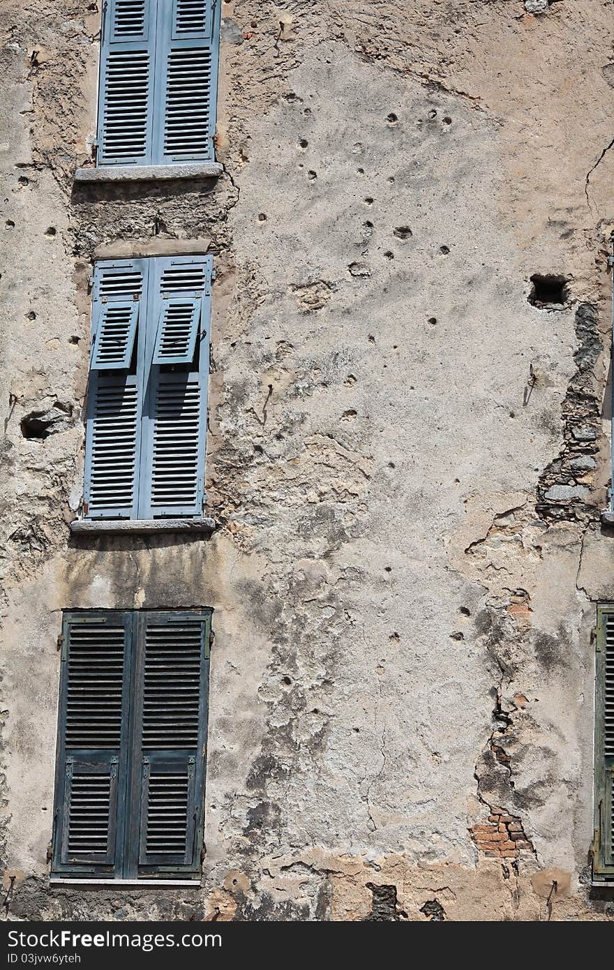 Bullet holes covering a house