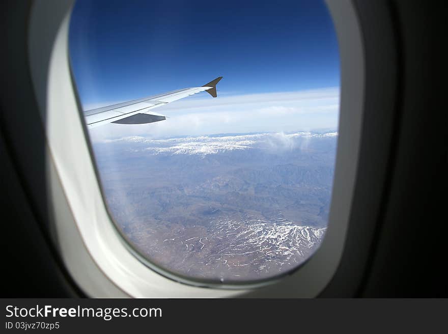 Aircraft illuminator window view, wing