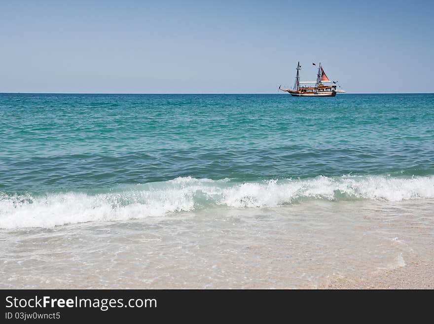 Tourist ship near coast on the sea. Tourist ship near coast on the sea