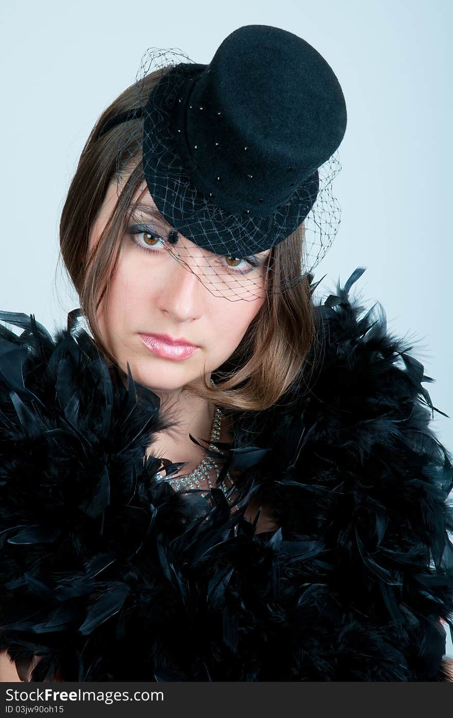 Close-up of beautiful young woman in a cabaret inspiration.