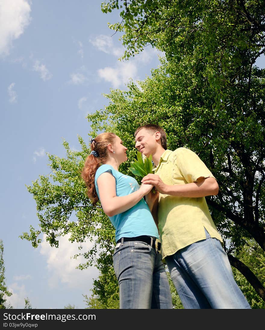 Adorable man and woman hug and enjoy nature. Adorable man and woman hug and enjoy nature