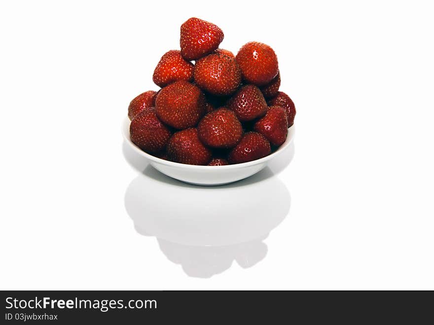 Fresh red strawberries in white bowl on white, nobody, mirror reflection,