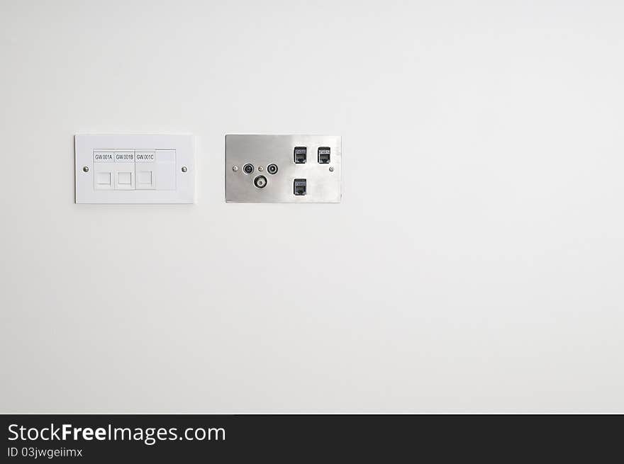 Wall socket for ethernet connections on a white wall. Wall socket for ethernet connections on a white wall